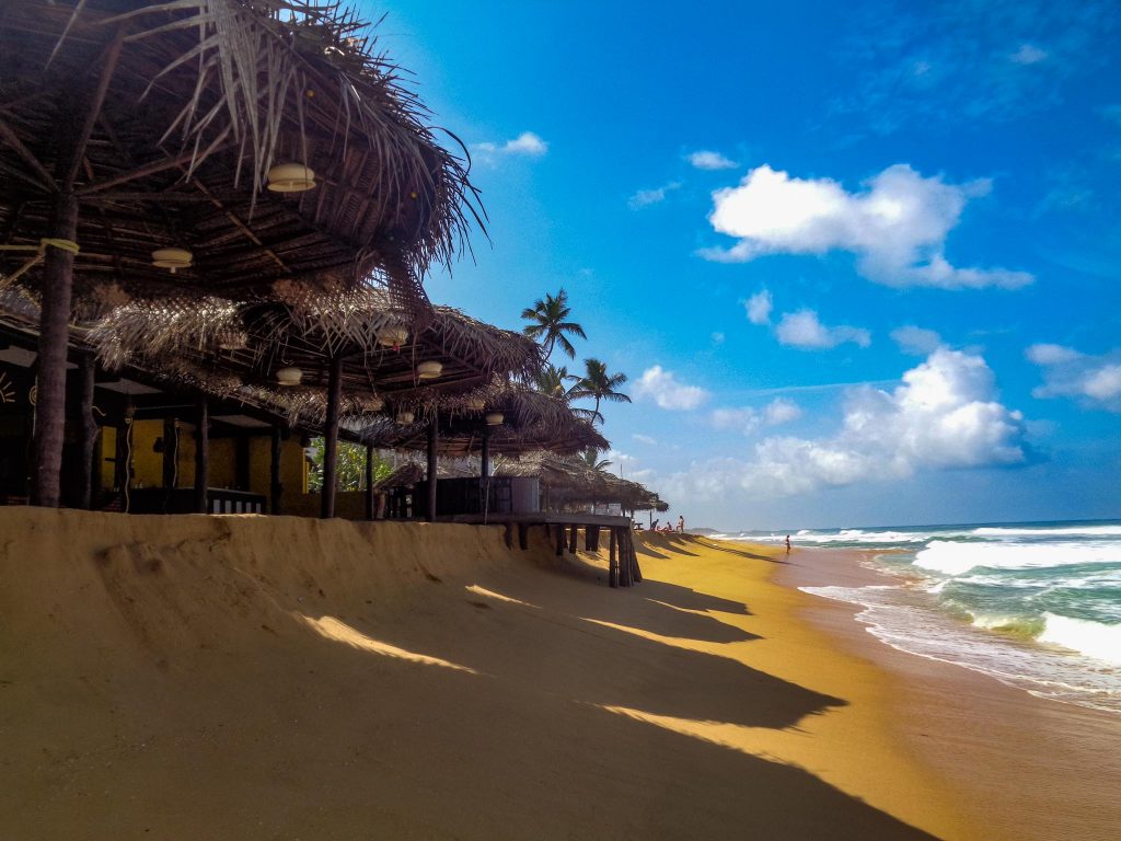 Beach with ocean and coast huts
