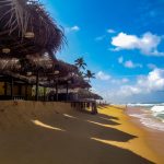 Beach with ocean and coast huts