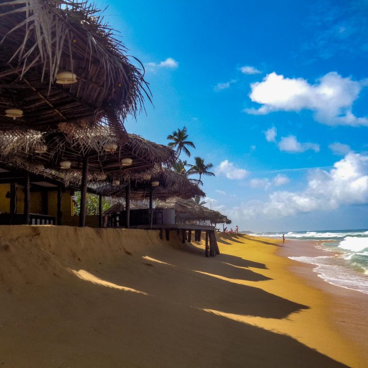 Beach with ocean and coast huts