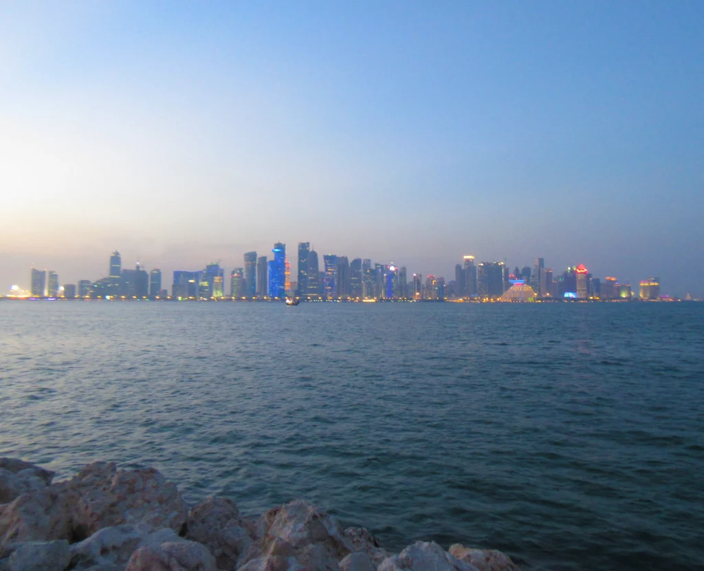a view of the new city line from old town, with coloured skyscrapers at sunset