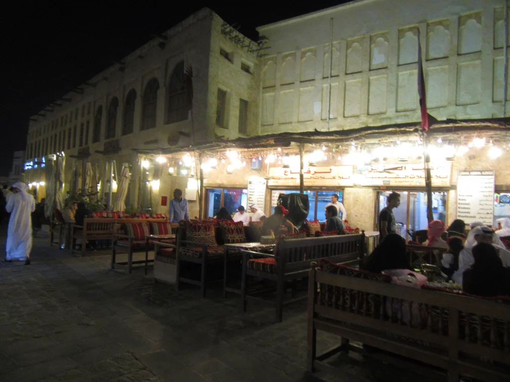 Qatar old town, night, small street, people sitting around tables