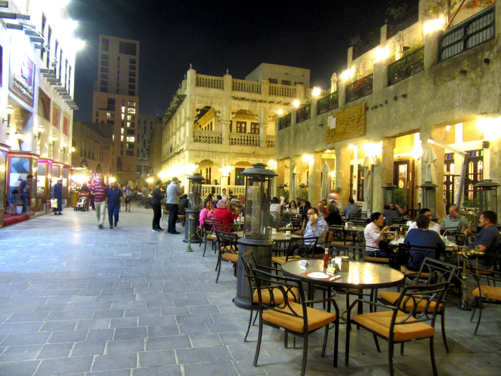 Qatar old town, night, small street, people sitting around tables