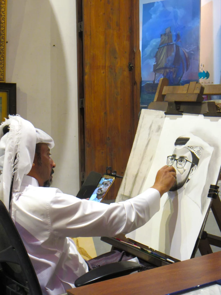 Qatar old town, night, a mad drawing a portrait from a photograph.