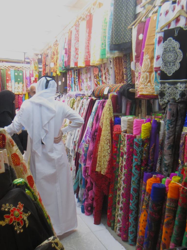 Qatar old town, the interior of a shop selling coloured materials for clothing