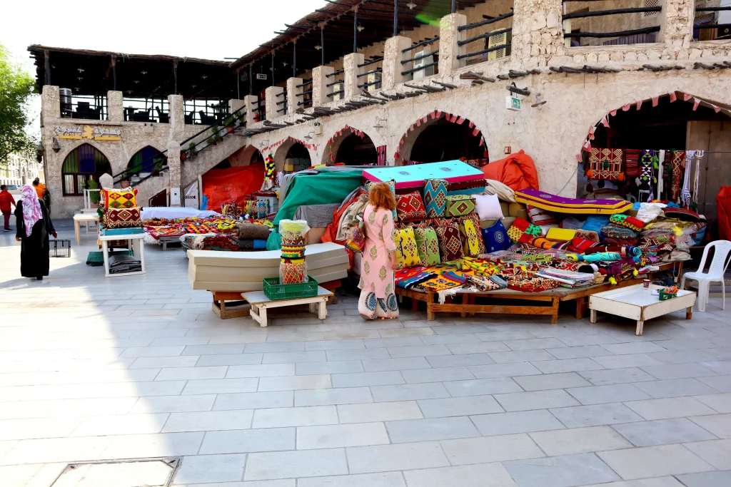 Qatar old town, day, a rug and pillow shop, a lot of coloured local merchandise