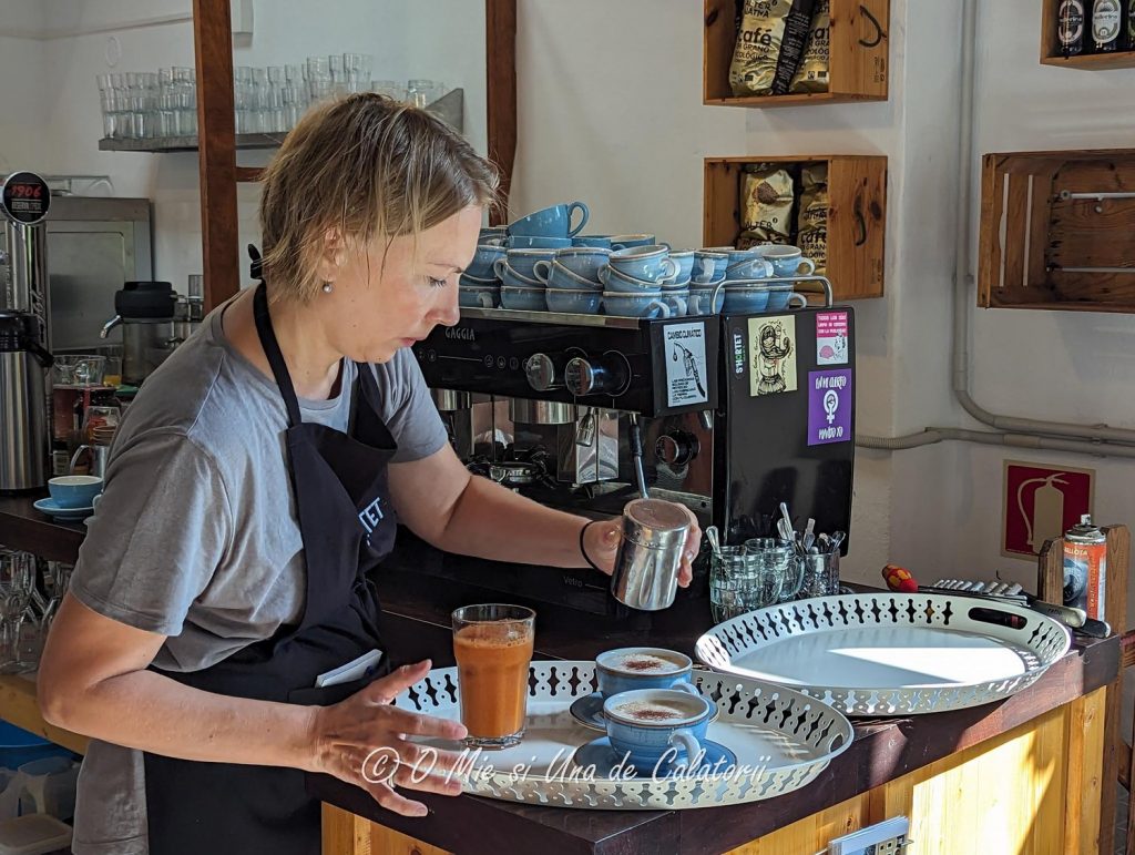 a barista preparing some coffee in a coffee shop