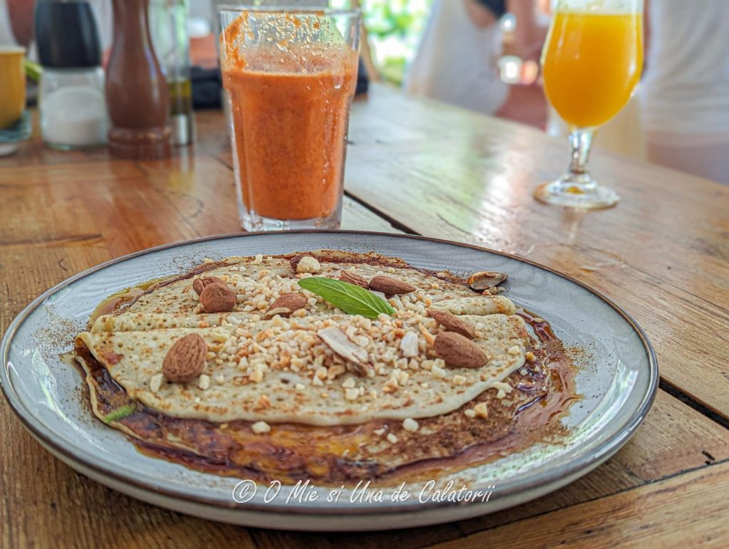 a closeup of a pancake with sauce and nuts