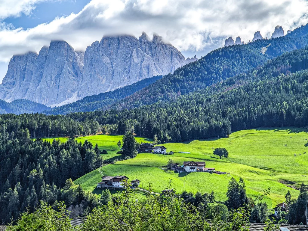 A wide shot from the dolomites with villas on the hills