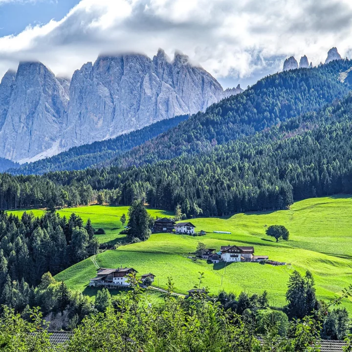 A wide shot from the dolomites with villas on the hills