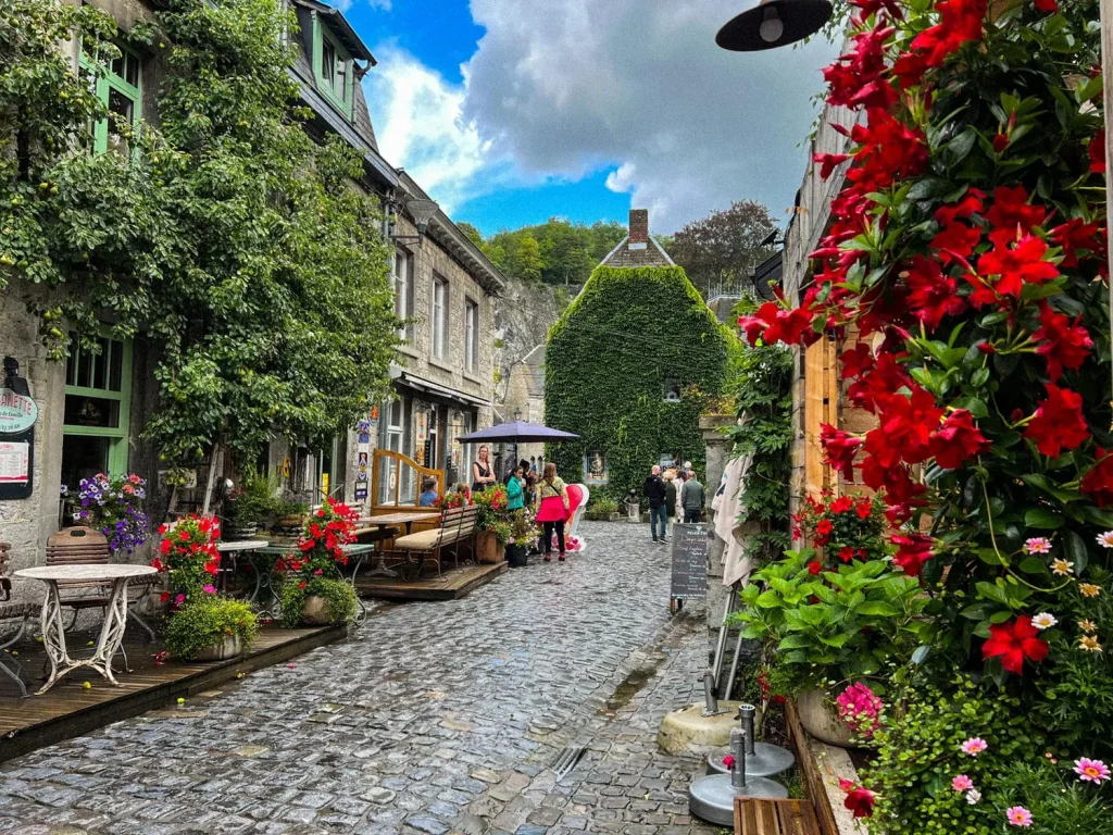 Belgium Durbuy small cobbled road full with flowers