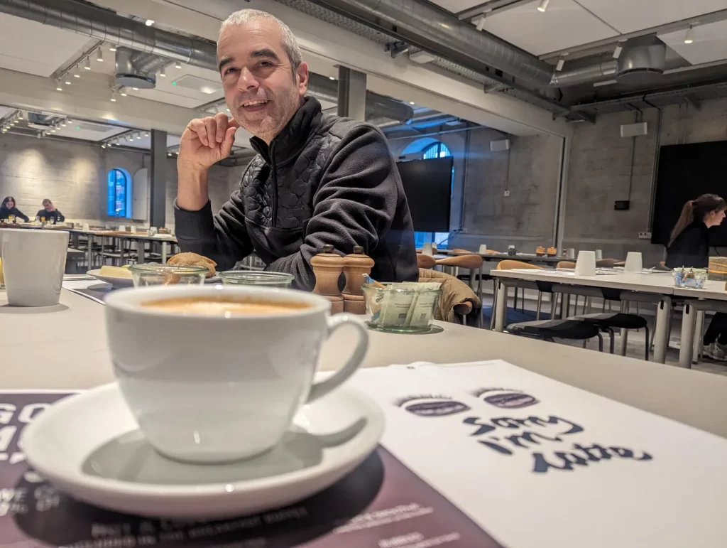 Denmark, a man enjoying breakfast and a coffee