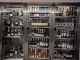 Denmark photo of a bar fridge full of various vine bottles.